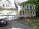 Inviting front of home with a two-car garage and covered porch, complemented by a neatly paved driveway at 1623 Rogers Pointe Ln, Creedmoor, NC 27522