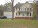 Front exterior view of a two-story home with an attached two-car garage at 1623 Rogers Pointe Ln, Creedmoor, NC 27522