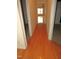 Open hallway featuring hardwood floors and natural light at 1623 Rogers Pointe Ln, Creedmoor, NC 27522