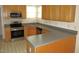 Corner kitchen with stainless steel appliances and a large, functional countertop area at 1623 Rogers Pointe Ln, Creedmoor, NC 27522
