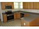 Well lit kitchen features stainless steel appliances and a neutral color scheme at 1623 Rogers Pointe Ln, Creedmoor, NC 27522