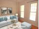 Staged living room with light blue furniture, decorative pillows, and a bright, inviting atmosphere at 1623 Rogers Pointe Ln, Creedmoor, NC 27522