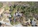 Aerial view of a single Gathering residence with mature landscaping, providing a sense of privacy at 167 Coachmans Cove Rd, Four Oaks, NC 27524