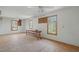 Spacious bonus room featuring multiple windows for natural light and ceiling fans for added comfort at 167 Coachmans Cove Rd, Four Oaks, NC 27524