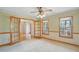 Bright dining room with hardwood French doors, carpet, and classic wallpaper design at 167 Coachmans Cove Rd, Four Oaks, NC 27524