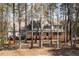 Charming two-story home with a large front porch, offering a peaceful and inviting curb appeal at 167 Coachmans Cove Rd, Four Oaks, NC 27524