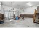 Spacious garage with brick accents, multiple garage doors, and ample room for storage and vehicles at 167 Coachmans Cove Rd, Four Oaks, NC 27524