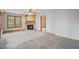 Comfortable living room featuring a cozy fireplace and a doorway to another room at 167 Coachmans Cove Rd, Four Oaks, NC 27524