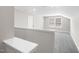 Upstairs bonus room featuring a window and neutral decor at 1801 Angelonia Way, Fuquay Varina, NC 27526