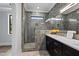 Modern bathroom with a gray tiled shower, double sink vanity and contemporary finishes at 1886 Mays Crossroad Rd, Louisburg, NC 27549