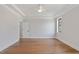 Spacious bedroom with a tray ceiling, ceiling fan and hardwood floors at 1886 Mays Crossroad Rd, Louisburg, NC 27549