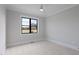 Bright bedroom showcasing a view of mature trees out the window at 1886 Mays Crossroad Rd, Louisburg, NC 27549