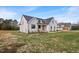 Stunning new construction farmhouse with black framed windows and professional landscaping on a spacious lot at 1886 Mays Crossroad Rd, Louisburg, NC 27549