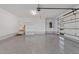 Finished garage with epoxy flooring, overhead lighting, water heater, and a built-in storage area at 1886 Mays Crossroad Rd, Louisburg, NC 27549