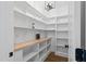 Bright pantry with custom shelving, butcher block countertop, and wood flooring at 1886 Mays Crossroad Rd, Louisburg, NC 27549