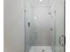 Contemporary shower featuring glass doors, bright lighting, and sleek design at 1886 Mays Crossroad Rd, Louisburg, NC 27549