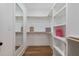 Well-organized walk-in closet with custom shelving and ample storage space at 1886 Mays Crossroad Rd, Louisburg, NC 27549