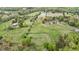 Aerial view of a large lot with lush greenery and mature trees at 2011 Gibsonville Ossipee Rd, Elon, NC 27244