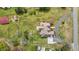 A captivating aerial shot showcases the home's roof, driveway, and lush surrounding landscape at 2011 Gibsonville Ossipee Rd, Elon, NC 27244