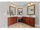 Bathroom featuring dual sinks, tile flooring, wood cabinets and vanity space at 2011 Gibsonville Ossipee Rd, Elon, NC 27244
