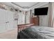 Bedroom featuring a bed, dark wood dresser, carpet, and tray ceiling at 2011 Gibsonville Ossipee Rd, Elon, NC 27244
