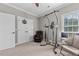 Bedroom with exercise equipment, a chair, carpet, and a ceiling fan at 2011 Gibsonville Ossipee Rd, Elon, NC 27244