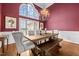 Formal dining room with a large window, elegant chandelier, and a stylish dining set at 2011 Gibsonville Ossipee Rd, Elon, NC 27244