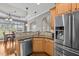 Updated kitchen features stainless steel appliances, granite countertops, and natural wood cabinetry at 2011 Gibsonville Ossipee Rd, Elon, NC 27244