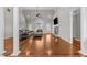 Spacious living room featuring hardwood floors, a stone fireplace, and plenty of natural light at 2011 Gibsonville Ossipee Rd, Elon, NC 27244