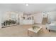 Spacious living room with an open layout, flowing into the dining area and kitchen, perfect for entertaining at 2013 Magnolia Tree Ln, Durham, NC 27703