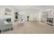 Bright and airy living room featuring a fireplace, large windows, and neutral decor for a comfortable living space at 2013 Magnolia Tree Ln, Durham, NC 27703