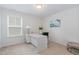 Bright office space with a large desk and natural light from the window at 2013 Magnolia Tree Ln, Durham, NC 27703