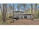 Backyard of a two-story home featuring a deck and stairs at 206 Rocky Hills Rd, Pittsboro, NC 27312