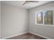 Cozy bedroom with wood floors, a ceiling fan, and a sun-filled window at 206 Rocky Hills Rd, Pittsboro, NC 27312