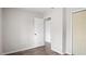 Clean bedroom with wood floors, white trim and multiple closets at 206 Rocky Hills Rd, Pittsboro, NC 27312