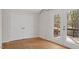 Cozy bedroom with hardwood floors, a spacious closet, and access to a private balcony at 206 Rocky Hills Rd, Pittsboro, NC 27312