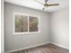 Cozy bedroom with wood floors, a ceiling fan, and a sun-filled window at 206 Rocky Hills Rd, Pittsboro, NC 27312