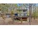 Charming home with a spacious deck perfect for outdoor entertaining and enjoying nature at 206 Rocky Hills Rd, Pittsboro, NC 27312
