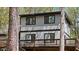 Exterior shot of the home showing the windows and deck at 206 Rocky Hills Rd, Pittsboro, NC 27312