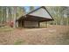 Detached garage with covered parking in a wooded setting at 206 Rocky Hills Rd, Pittsboro, NC 27312