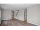 Bright living room featuring wood floors, staircase access, and neutral paint at 206 Rocky Hills Rd, Pittsboro, NC 27312