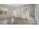Open-plan living space features wood-style flooring, ample natural light and stairs to another level at 206 Rocky Hills Rd, Pittsboro, NC 27312