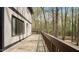 Expansive wooden deck perfect for entertaining with views of the surrounding wooded landscape at 206 Rocky Hills Rd, Pittsboro, NC 27312