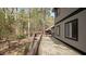 Spacious wooden deck offering serene views of the surrounding lush greenery at 206 Rocky Hills Rd, Pittsboro, NC 27312