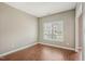 Bright and airy bedroom with wood floors and a large window at 2223 Lazy River Dr, Raleigh, NC 27610