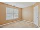 Comfortable bedroom with natural light and neutral tones, complete with standard window and door at 2223 Lazy River Dr, Raleigh, NC 27610
