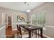 Cozy dining area with modern decor, a large window and access to the kitchen at 2223 Lazy River Dr, Raleigh, NC 27610