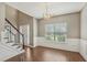 Elegant dining room with hardwood floors, wainscoting, chandelier, and ample natural light at 2223 Lazy River Dr, Raleigh, NC 27610