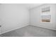 Bedroom with neutral carpeting, a window, and white walls at 2304 Beeblossom Pl, Fuquay Varina, NC 27526