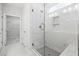Modern glass shower with marble tile and a rainfall shower head at 2304 Beeblossom Pl, Fuquay Varina, NC 27526